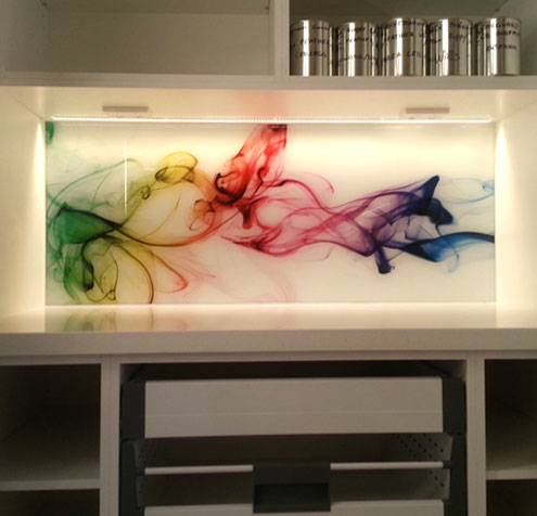 Glass printing - custom printed glass kitchen splashback with an abstract rainbow effect.