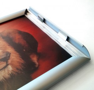 Snapframe poster mounting system from Wild Digital. Image shows front opening hinge.